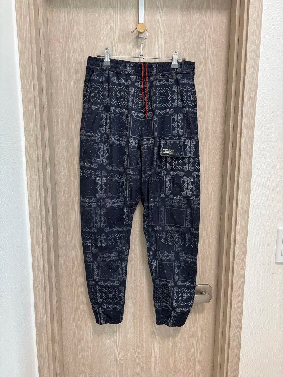 SOUTH CAPE レディース ゴルフ プリント ISTJ VENDING MACHINE Ver. ジョガーパンツS 67 ネイビー