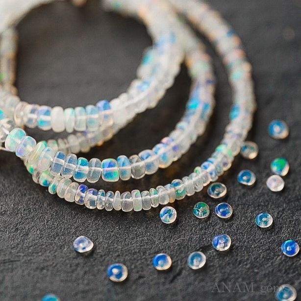 エチオピア産 プレシャスオパール スムースドロップ 1連 エチオピア産 プレシャス オパール スムース ボタン ビーズ乳白 40cm