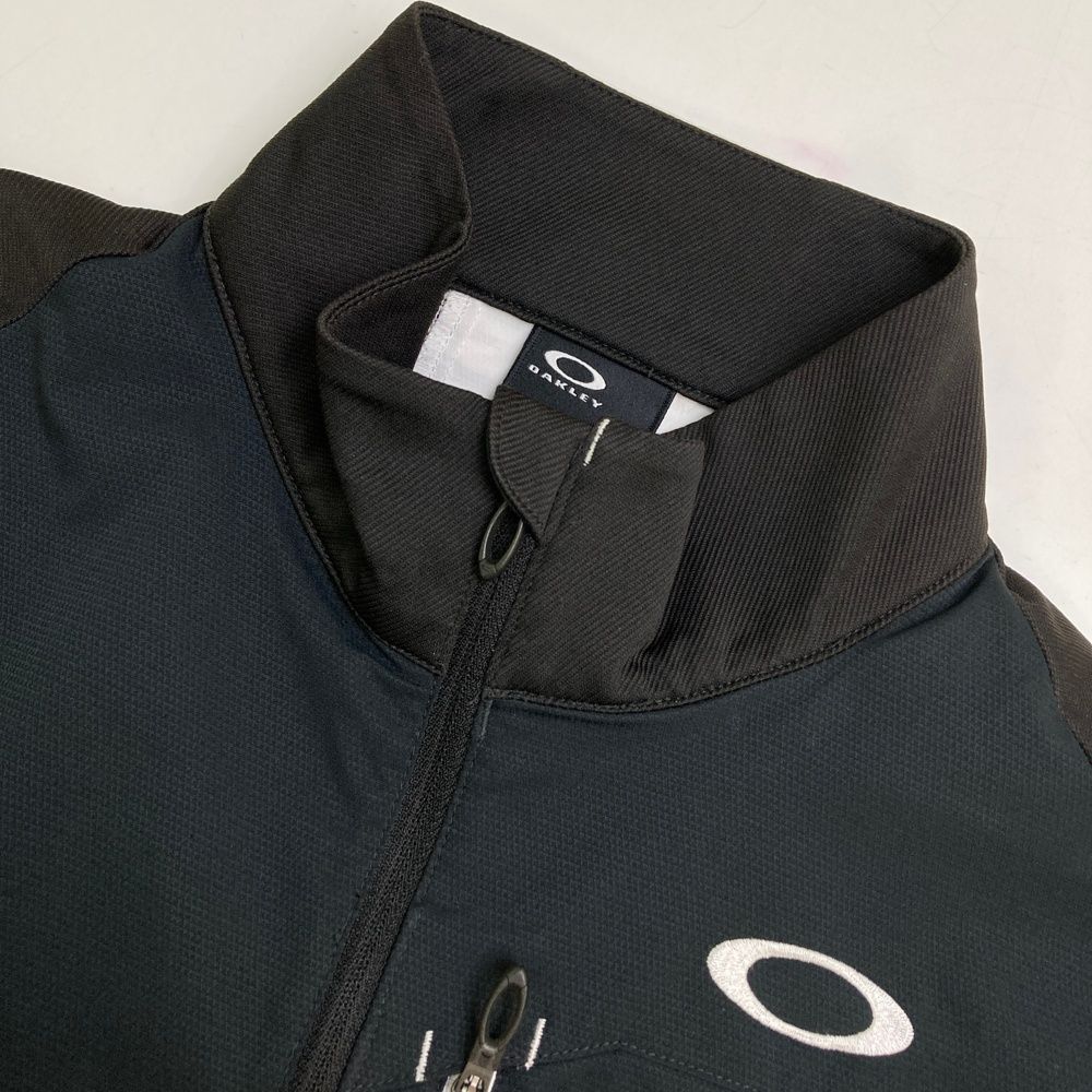サイズ：S OAKLEY オークリー 411855JP ジップジャケット  ブラック系 [240101469376] ゴルフウェア メンズ ストスト OAKLEY オークリー 411855JP ジップジャケット ブラック系