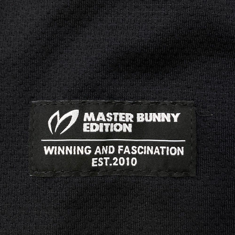サイズ：5 MASTER BUNNY EDITION マスターバニーエディション  モックネック 長袖 Tシャツ  ブラック系 [240101470043] ゴルフウェア メンズ ストスト サイズ：5 MASTER BUNNY EDITION マスターバニーエディション