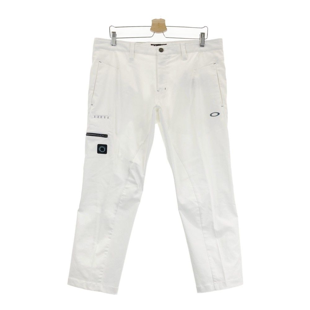 サイズ：38 OAKLEY オークリー FOA404134 コットン混 ストレッチパンツ スカル刺繍  ホワイト系 [240101455308] ゴルフウェア メンズ ストスト サイズ：38 OAKLEY オークリー FOA404134 コットン混 ストレッチ