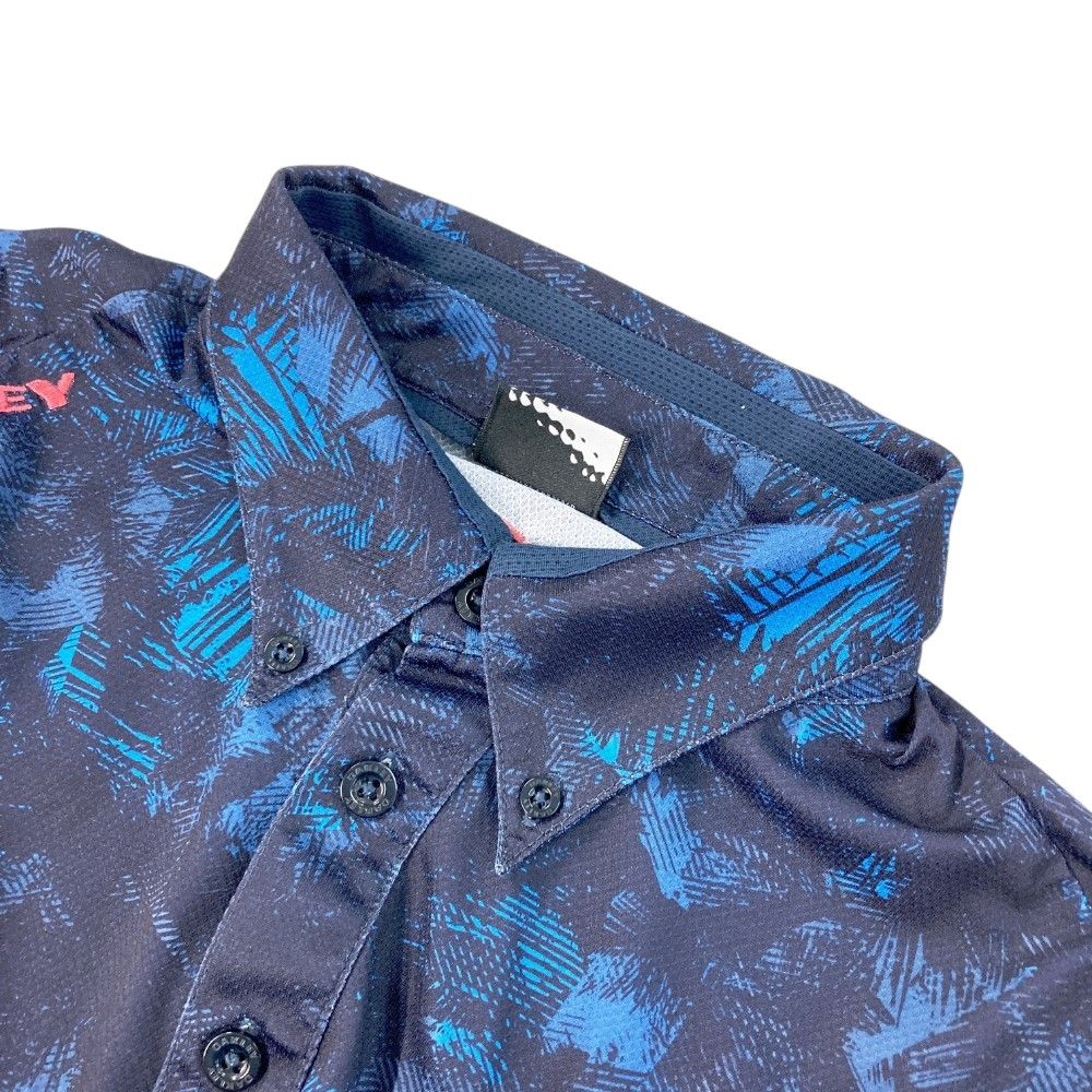 サイズ：XL OAKLEY オークリー 433627JP 半袖ポロシャツ ボタンダウン 総柄 ネイビー系 [240101421949] ゴルフウェア メンズ ストスト サイズ：XL OAKLEY オークリー 433627JP 半袖ポロシャツ ボタン