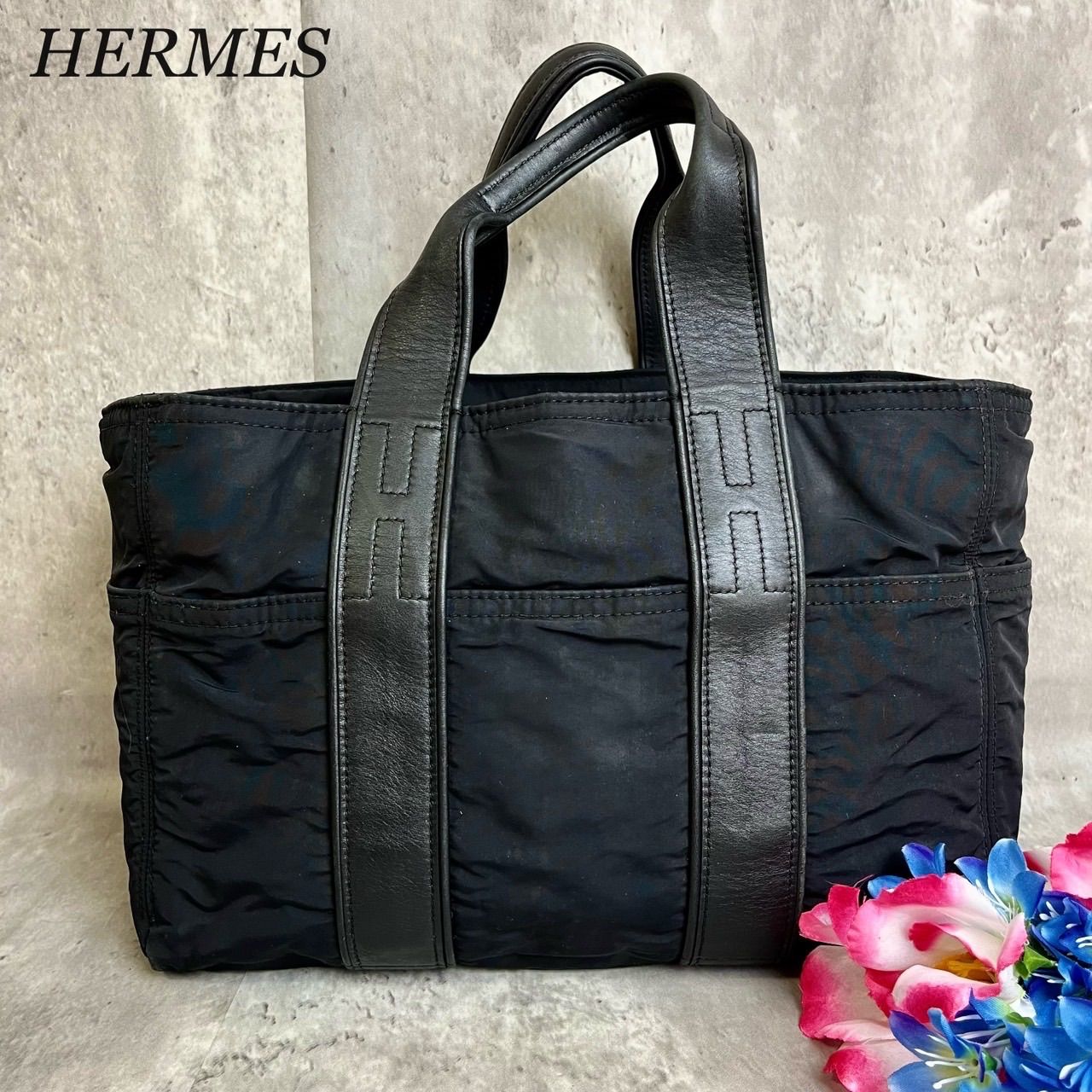 ✨格安✨ HERMES エルメス トートバッグ ハンドバッグ アカプルコ PM ロゴ型押し セリエボタン シルバー金具 ナイロン ラムレザー  ユニセックス レディース メンズ ブラック 黒色 - メルカリ