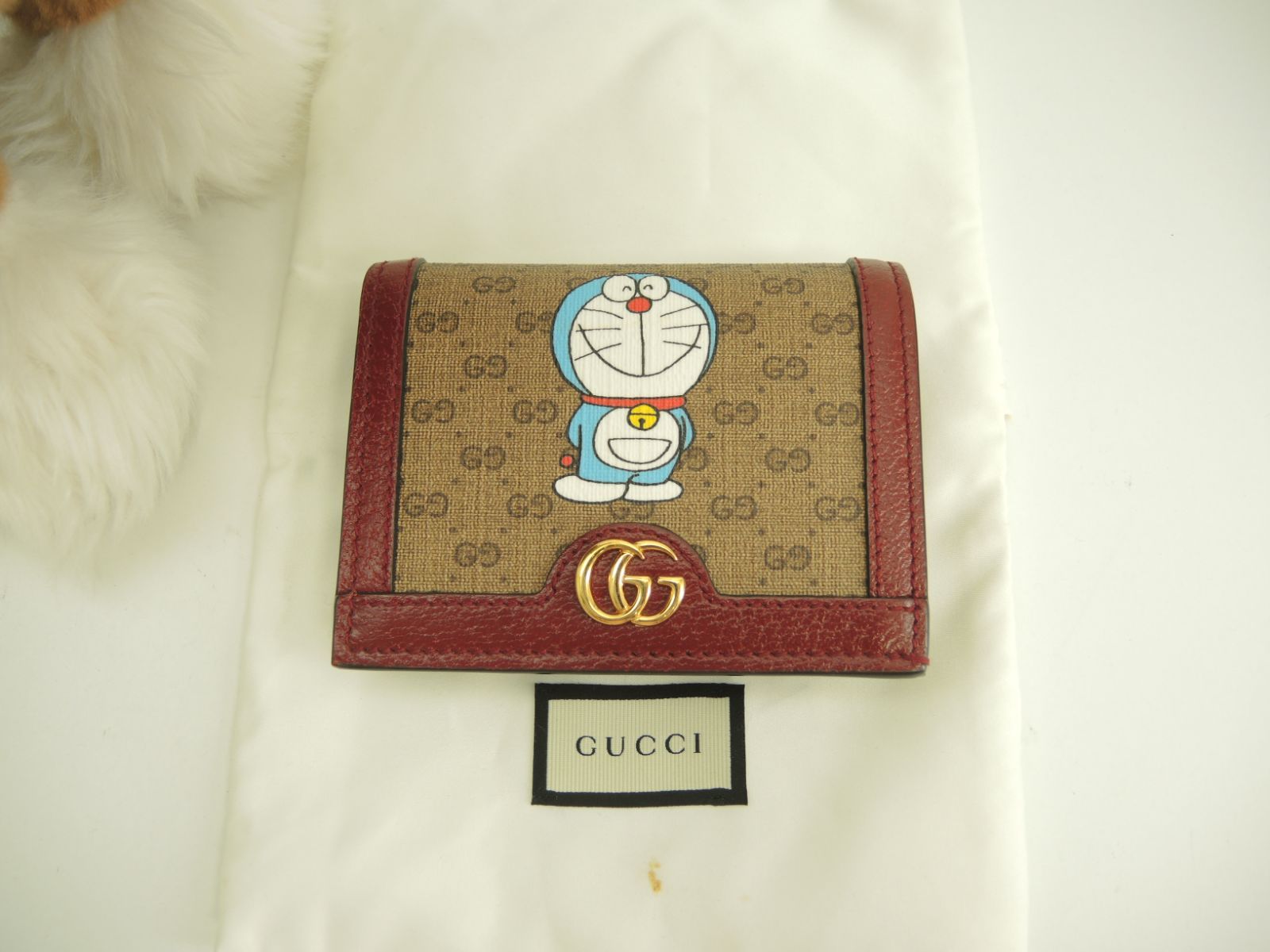 GUCCI(グッチ)×ドラえもん ミニウォレット 新品未使用 グッチ 2折財布 ドラえもん マイクロGG茶エンジ コンパクト
