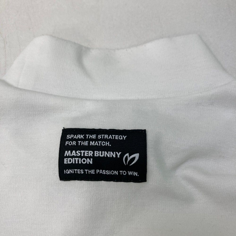 サイズ：2 MASTER BUNNY EDITION マスターバニーエディション 2025年モデル ハイネック 長袖Tシャツ  ホワイト系 [240101447005] ゴルフウェア レディース ストスト サイズ：2 MASTER BUNNY EDITION マスターバニーエディション