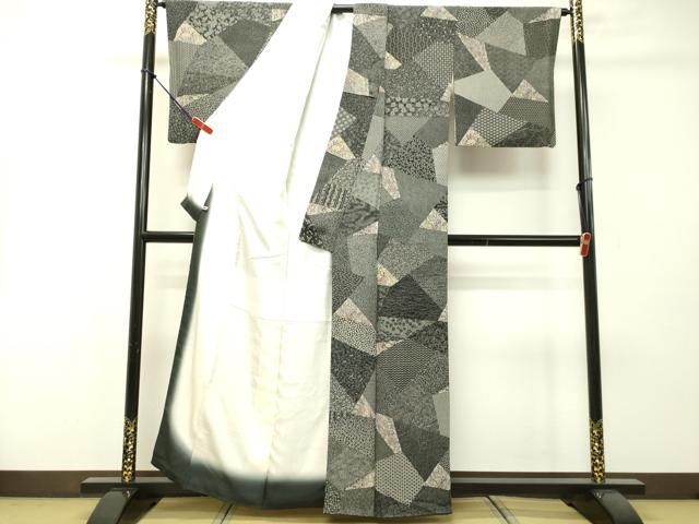 平和屋着物○伝統工芸士 染谷梅治 江戸小紋 切嵌更紗花文 黒地 さが美  