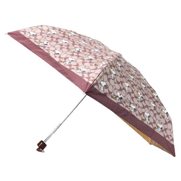 コーチ 傘 スヌーピー COACH ピーナッツ コラボ ウッドストック シグネチャー UVカット99% 晴雨兼用 日傘 ミニ アンブレラ 折りたたみ傘 ブラウンマルチ CBS80