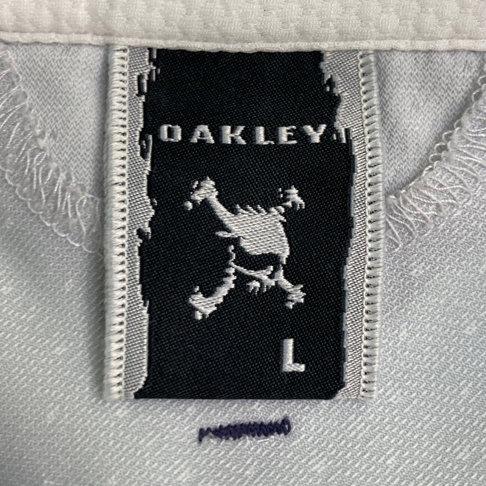 サイズ：XL OAKLEY オークリー 433963JP 半袖シャツ スカル刺繍 ドット 総柄 オレンジ系 [240101432762] ゴルフウェア メンズ ストスト OAKLEY オークリー 433963JP 半袖シャツ スカル刺繍 ドット 総柄