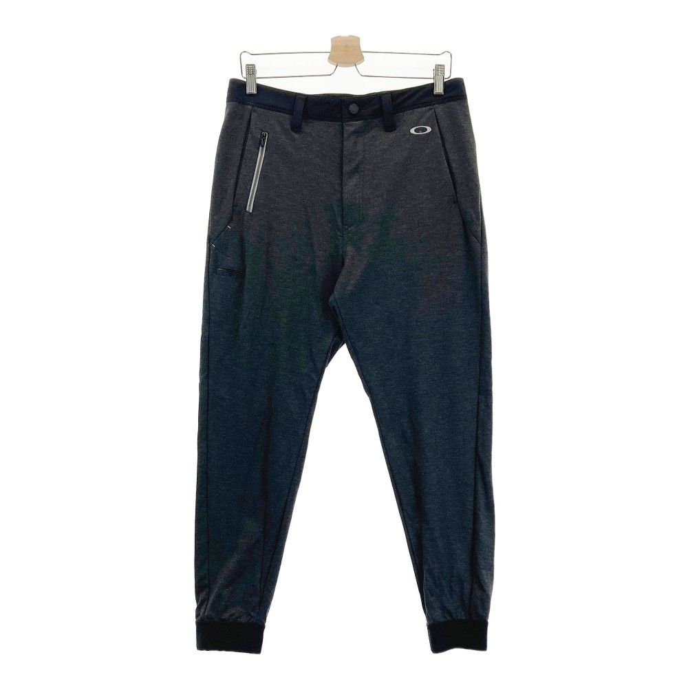 サイズ：33 OAKLEY オークリー ストレッチパンツ 総柄 スカル