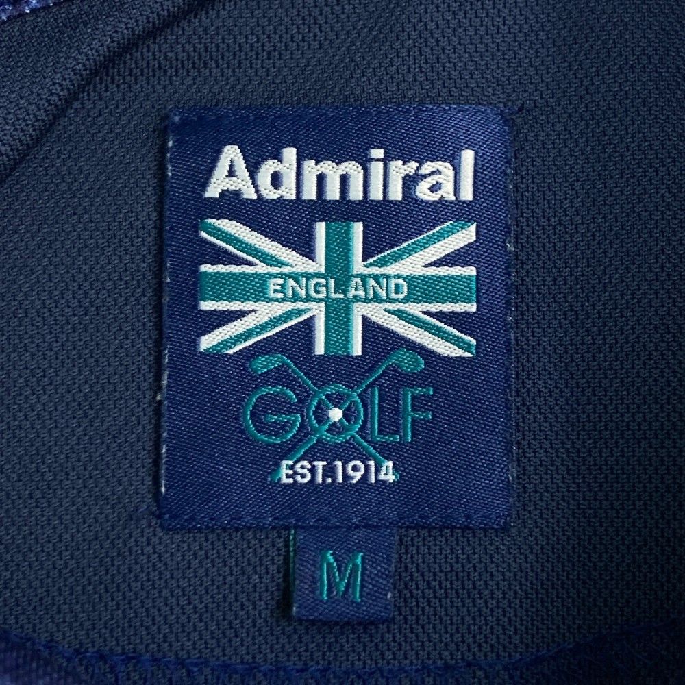 サイズ：M ADMIRAL アドミラル  半袖ポロシャツ 総柄 ネイビー系 [240101470398] ゴルフウェア メンズ ストスト サイズ：M ADMIRAL アドミラル 半袖ポロシャツ 総柄 ネイビー系