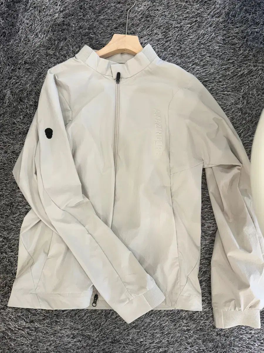 メンズゴルフ AMAZINGCRE ウィンドブレーカー アイボリー L
