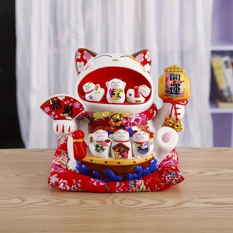 招き猫が家財道具を並べる。