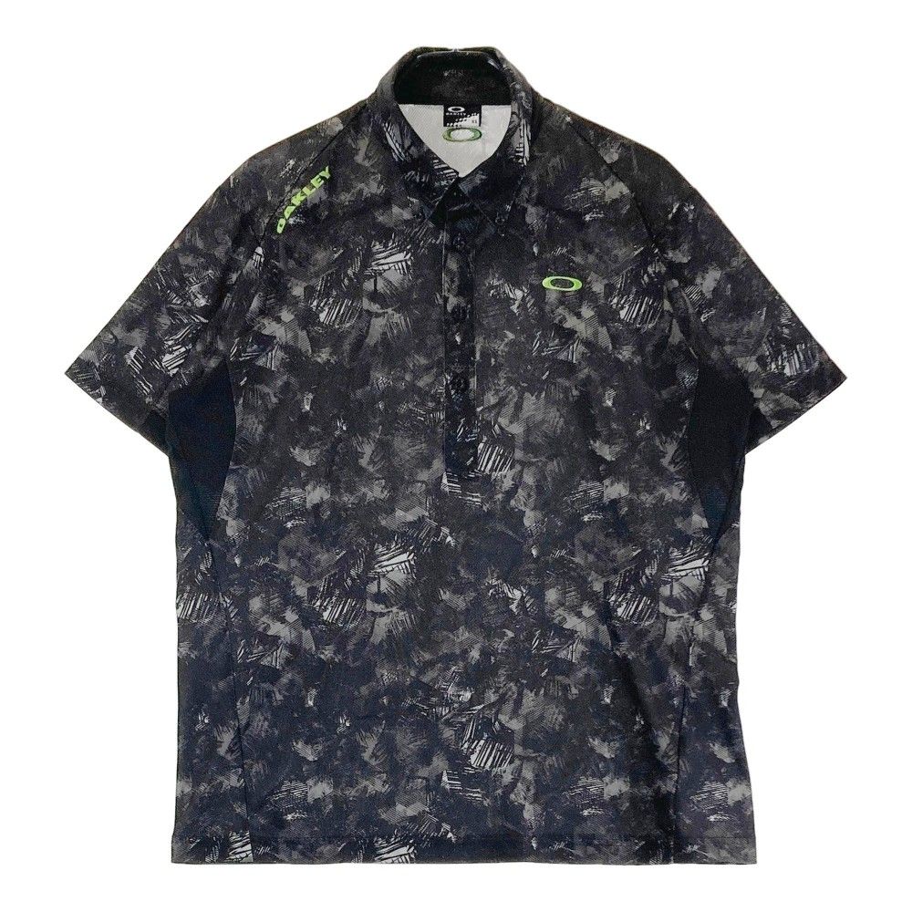 サイズ：XL OAKLEY オークリー 433627JP 半袖ポロシャツ ボタンダウン 総柄 ネイビー系 [240101421949] ゴルフウェア メンズ ストスト サイズ：XL OAKLEY オークリー 433627JP 半袖ポロシャツ ボタン