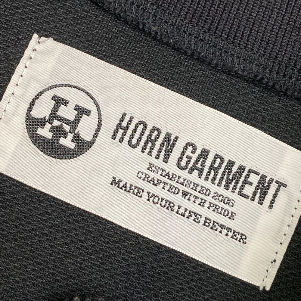 サイズ：38 HORN GMT ホーン ガーメント ×SMURFS 2024年モデル ハイネック 半袖Tシャツ  ブラック系 [240101497869] ゴルフウェア レディース ストスト サイズ：38 HORN GMT ホーン ガーメント ×SMURFS 2024年モデル