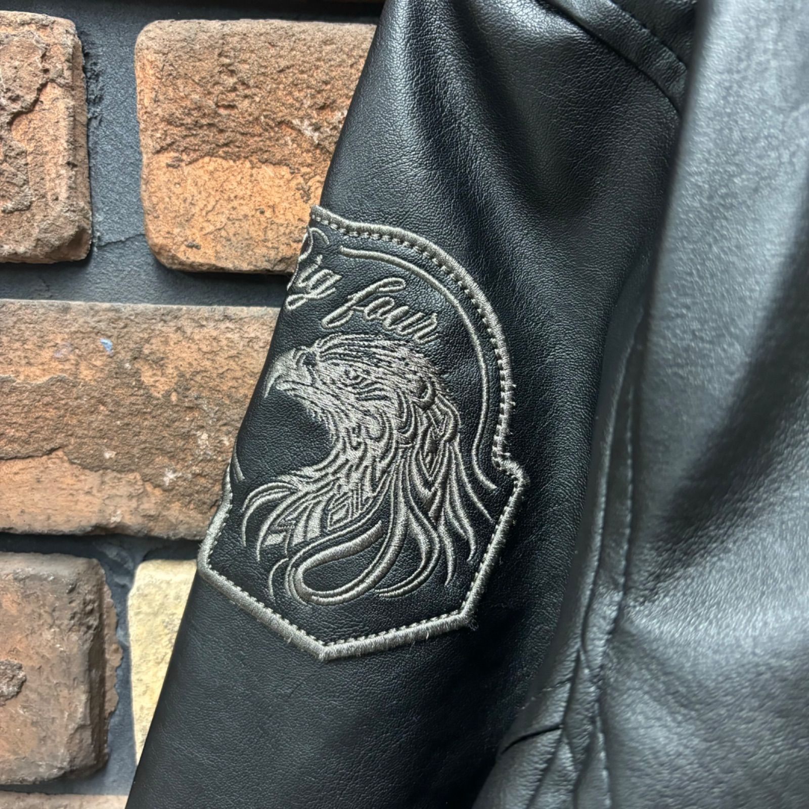 Norton フェイクレザー・ワッペン付きシングルライダースジャケット 