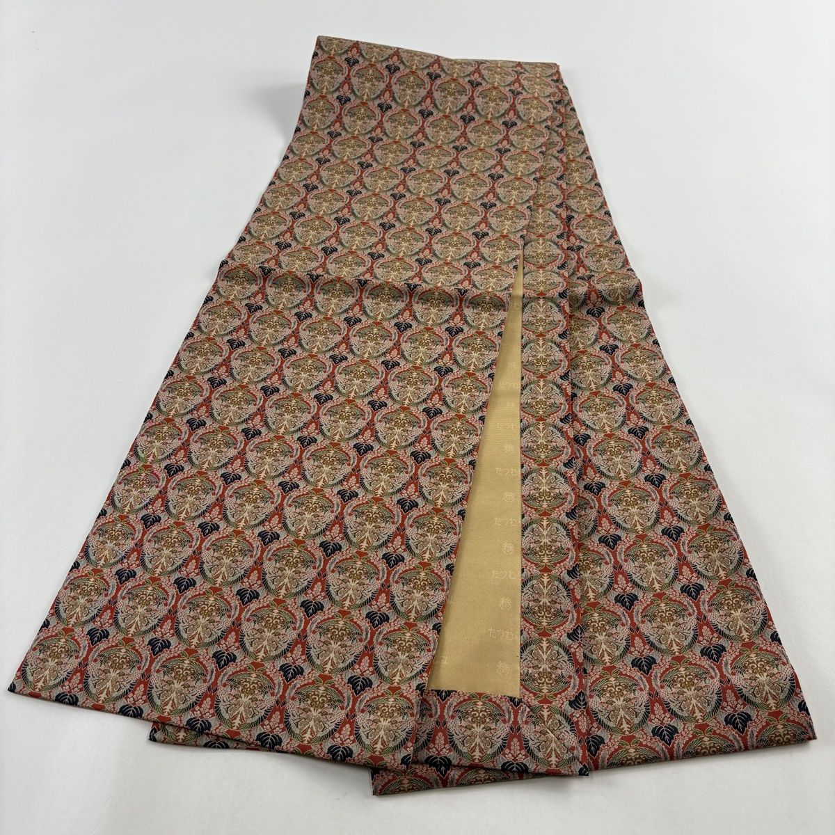 美品】 開き名古屋帯 逸品 龍村美術織物 比翼仕立て 草花 花唐草 金糸 黒