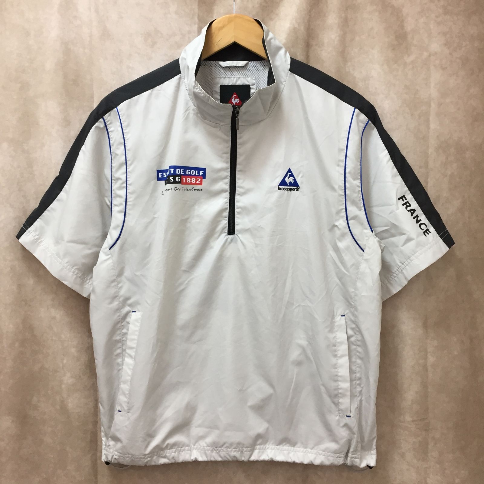 サイズ：L LE COQ GOLF ルコックゴルフ  ハーフジップ 半袖ブルゾン  レッド系 [240101432962] ゴルフウェア メンズ ストスト サイズ：L LE COQ GOLF ルコックゴルフ ハーフジップ 半袖