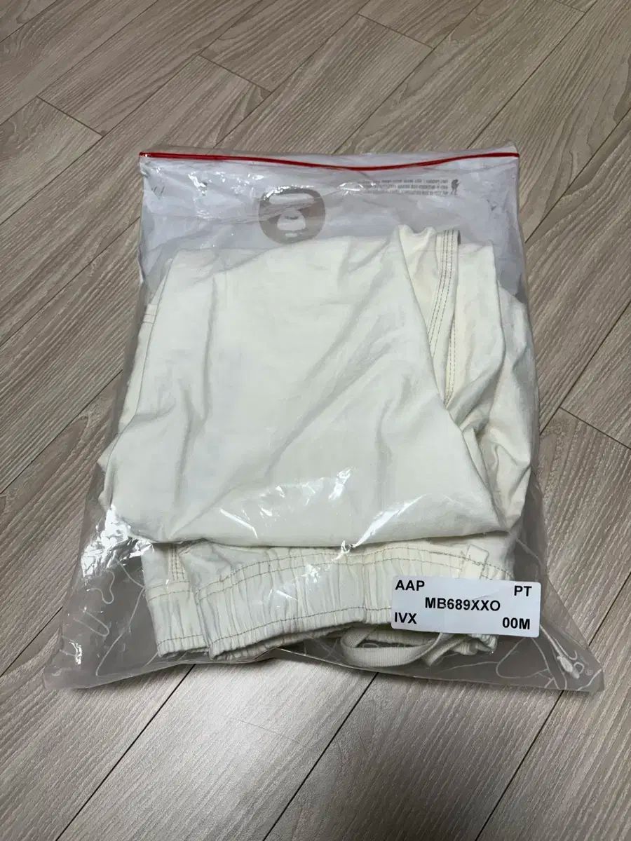 AAPEUNVS ムーンフェイス ロゴ リラックスフィット パンツ