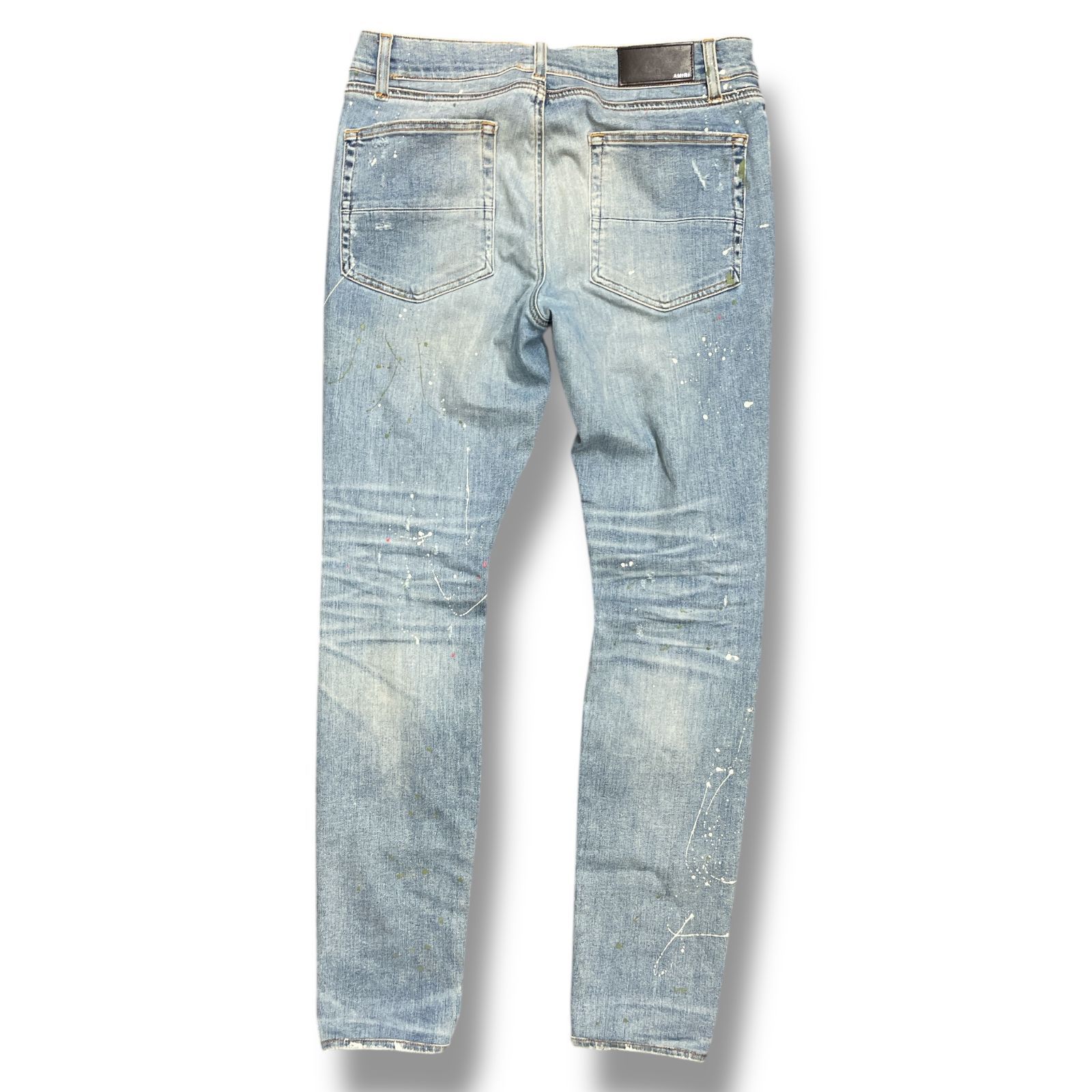 AMIRI インディゴ ブロークン ペインター トラック ジーンズ AMIRI ペイント加工 鶴ワッペン クラッシュデニムパンツ