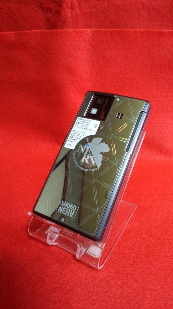 SHARP - 【希少品】SH-06D NERV エヴァンゲリオンスマホ　専用シリコンカバー付き s-l1200.png