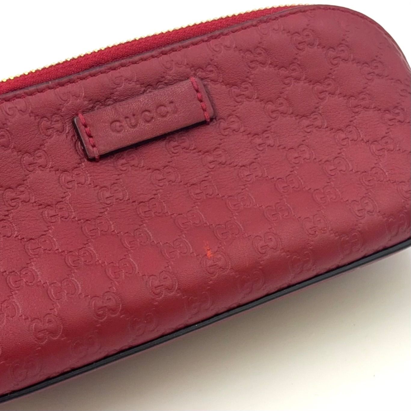 GUCCI マイクログッチシマ レザー レッド ポーチ ゴールド