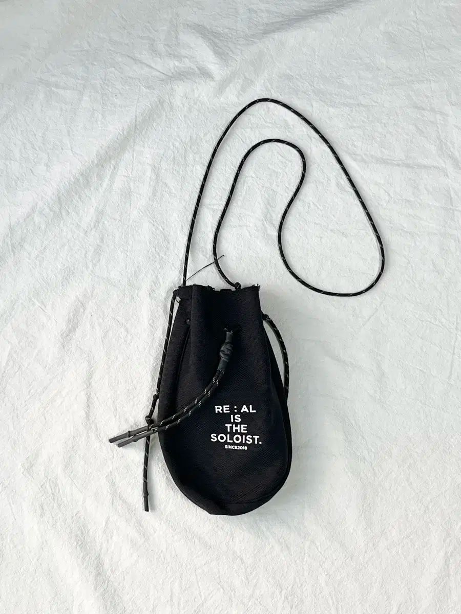タマヒロミヤシタ ザ ソロイスト ドローストリングバッグ クロスバッグ バッグ