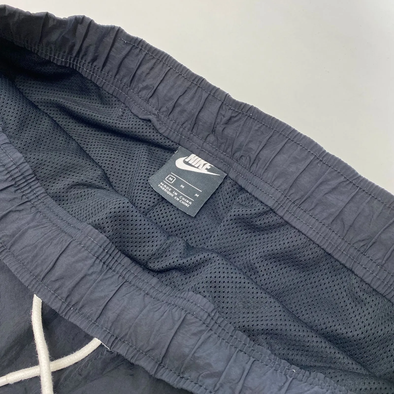 NIKE スウッシュ ウーブンパンツ CD0422-010 ブラック|mercariメルカリ 