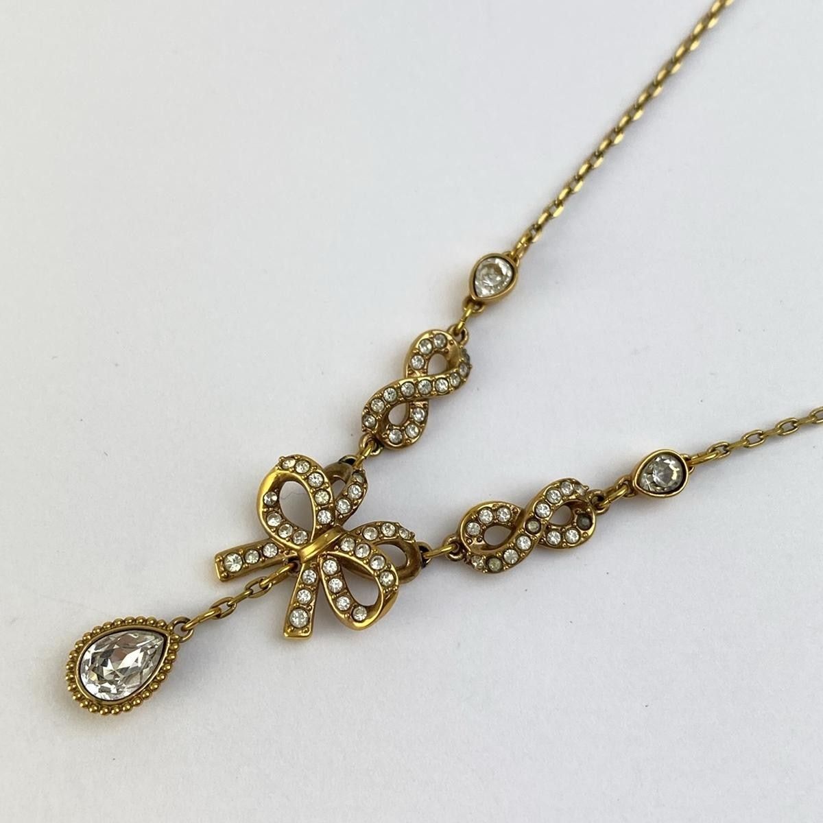 SWAROVSKI(スワロフスキー) ネックレス美品  ゴールド×クリア リボン