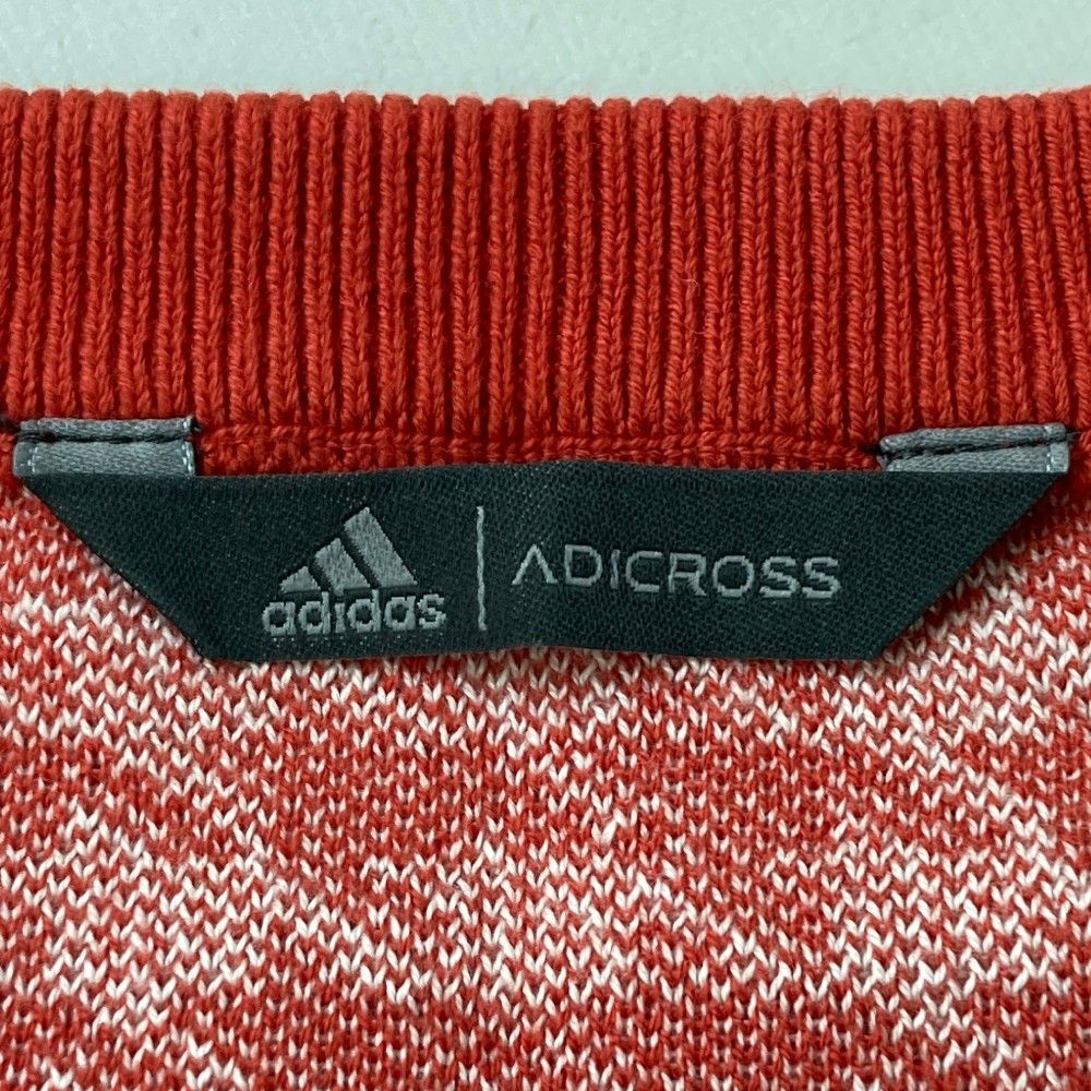 サイズ：O ADIDAS GOLF アディダスゴルフ adicross Vネック ニットベスト 千鳥柄 レッド系 [240101274297] ゴルフウェア メンズ ストスト