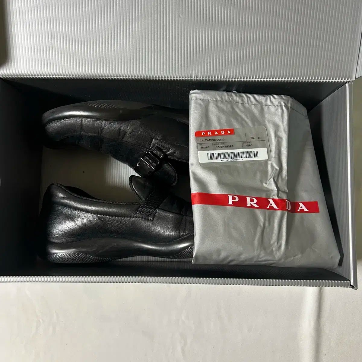 Prada sports buckle strap loafers