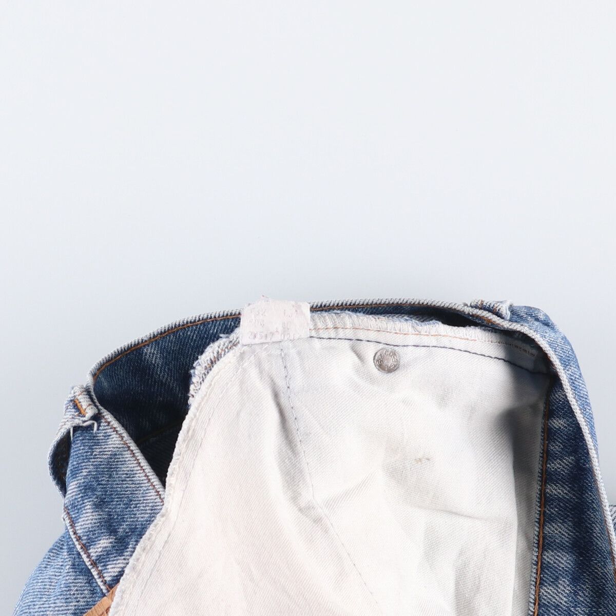 オレンジタブ ブーツカットデニムパンツ