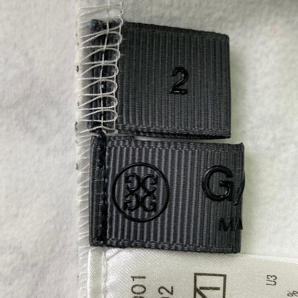 サイズ：2 G/FORE ジーフォア  ハイネック 長袖Tシャツ ロゴ総柄 ホワイト系 [240101468807] ゴルフウェア メンズ ストスト サイズ：2 G/FORE ジーフォア ハイネック 長袖Tシャツ ロゴ総柄