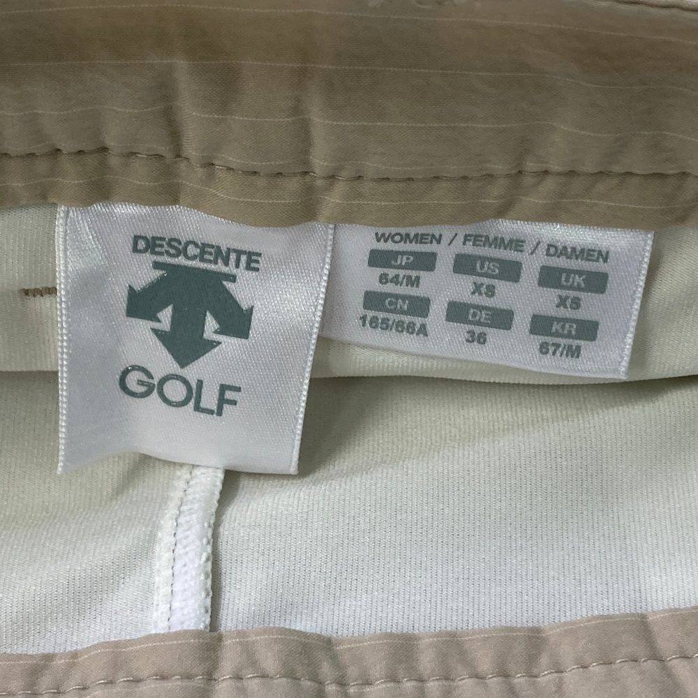 サイズ：M DESCENTE GOLF デサントゴルフ  インナー付 スカート  ベージュ系 [240101476637] ゴルフウェア レディース ストスト DESCENTE GOLF 【超美品】デサントゴルフ スカート ベージュ×白