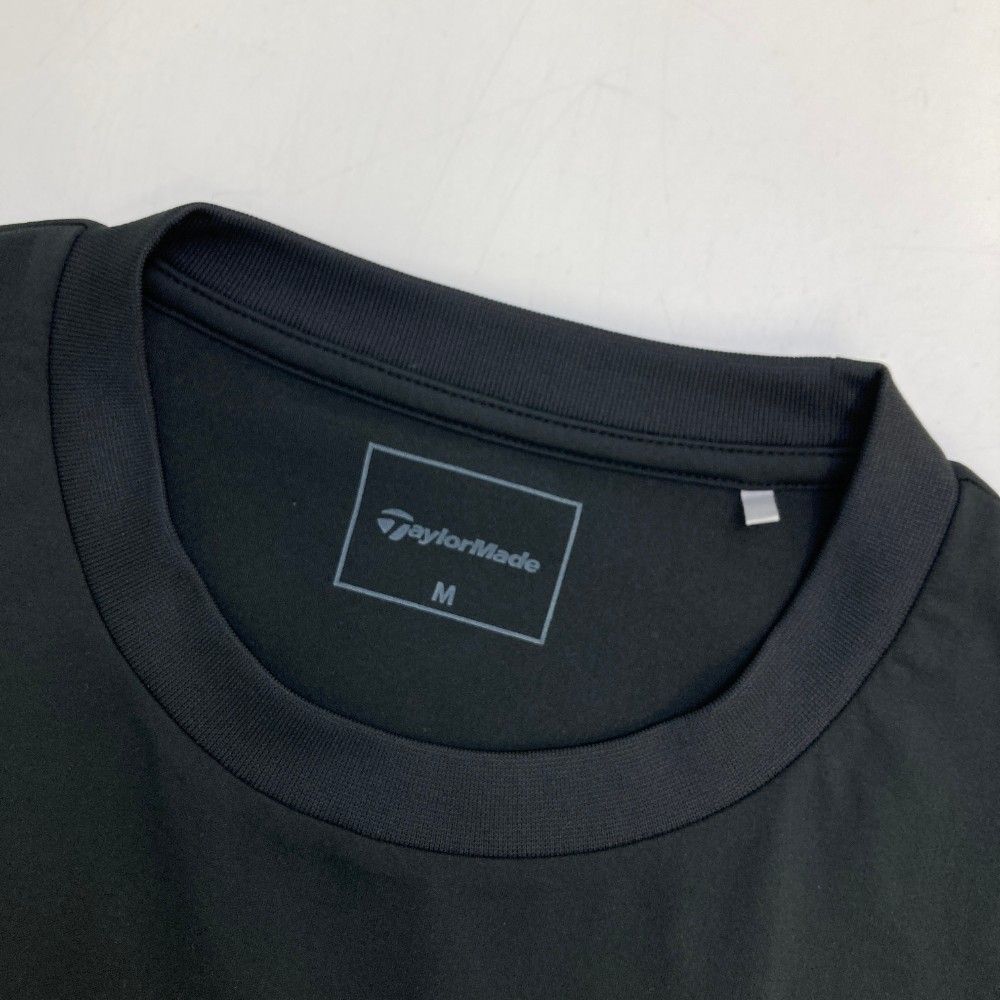 サイズ：M TAYLOR MADE テーラーメイド 2024年 半袖Tシャツ  ブラック系 [240101447307] ゴルフウェア メンズ ストスト サイズ：M TAYLOR MADE テーラーメイド 2024年 半袖Tシャツ