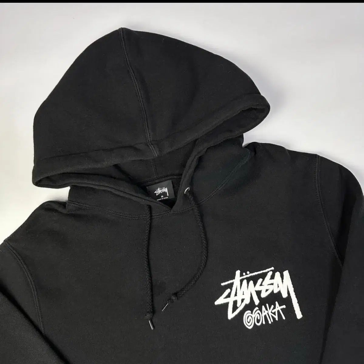 【雷市場（ポンジャン）商品韓国直送】 STUSSY(ステューシー) 大阪 フード付きTシャツ