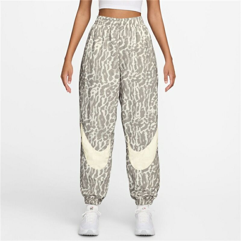 ナイキ ウィンドブレーカー ロングパンツ レディース NIKE ウーブン プリンテッドパンツ オーバーサイズ アニマル柄 ジョガーパンツ 軽量 はっ水 女性 ナイロパンツ スポーツウェア ウエア |IB7267-009