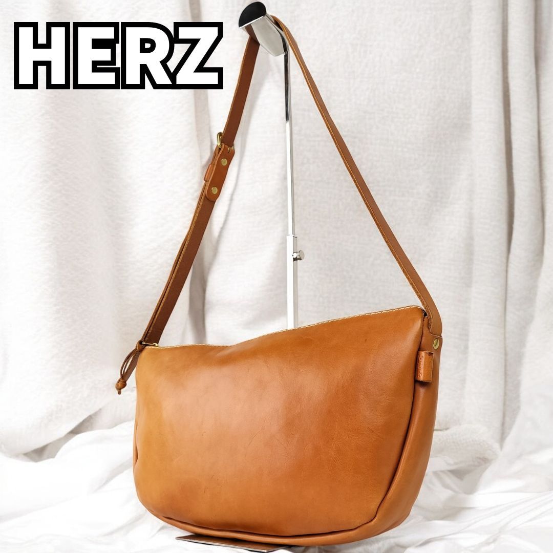 Herz SUNFACE ショルダーバッグ 見た目以上に荷物が入るガマ口式の本革ショルダーバッグ「革鞄の
