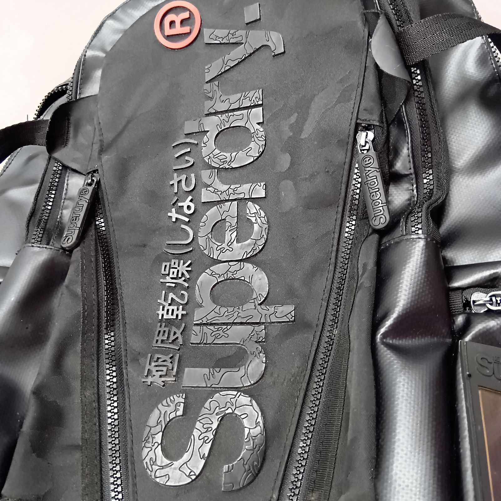 Superdry. バックパック リュック 極度乾燥しなさい ブラック オレンジ 