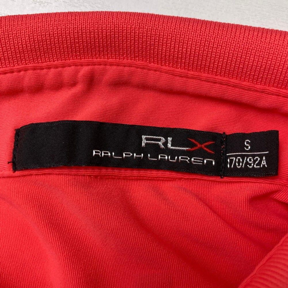 サイズ：S RLX ラルフローレン  ロゴプリント 半袖ポロシャツ  オレンジ系 [240101441690] ゴルフウェア メンズ ストスト サイズ：S RLX ラルフローレン ロゴプリント 半袖ポロシャツ