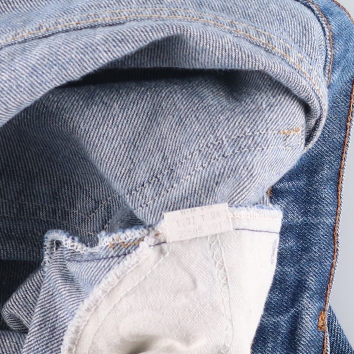 オレンジタブ テーパードデニムパンツ