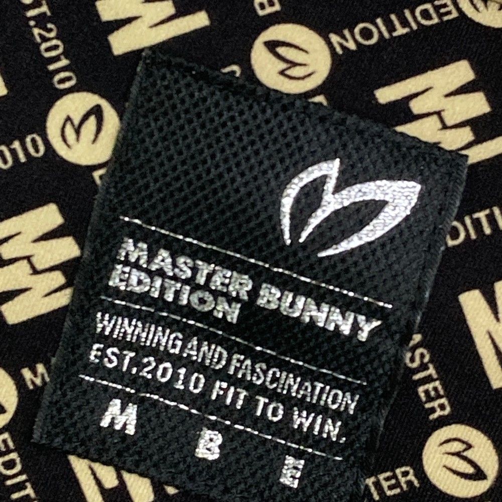 サイズ：1 MASTER BUNNY EDITION マスターバニーエディション  ハイネック 長袖Tシャツ 総柄 ブラック系 [240101468927] ゴルフウェア レディース ストスト サイズ：1 MASTER BUNNY EDITION マスターバニーエディション