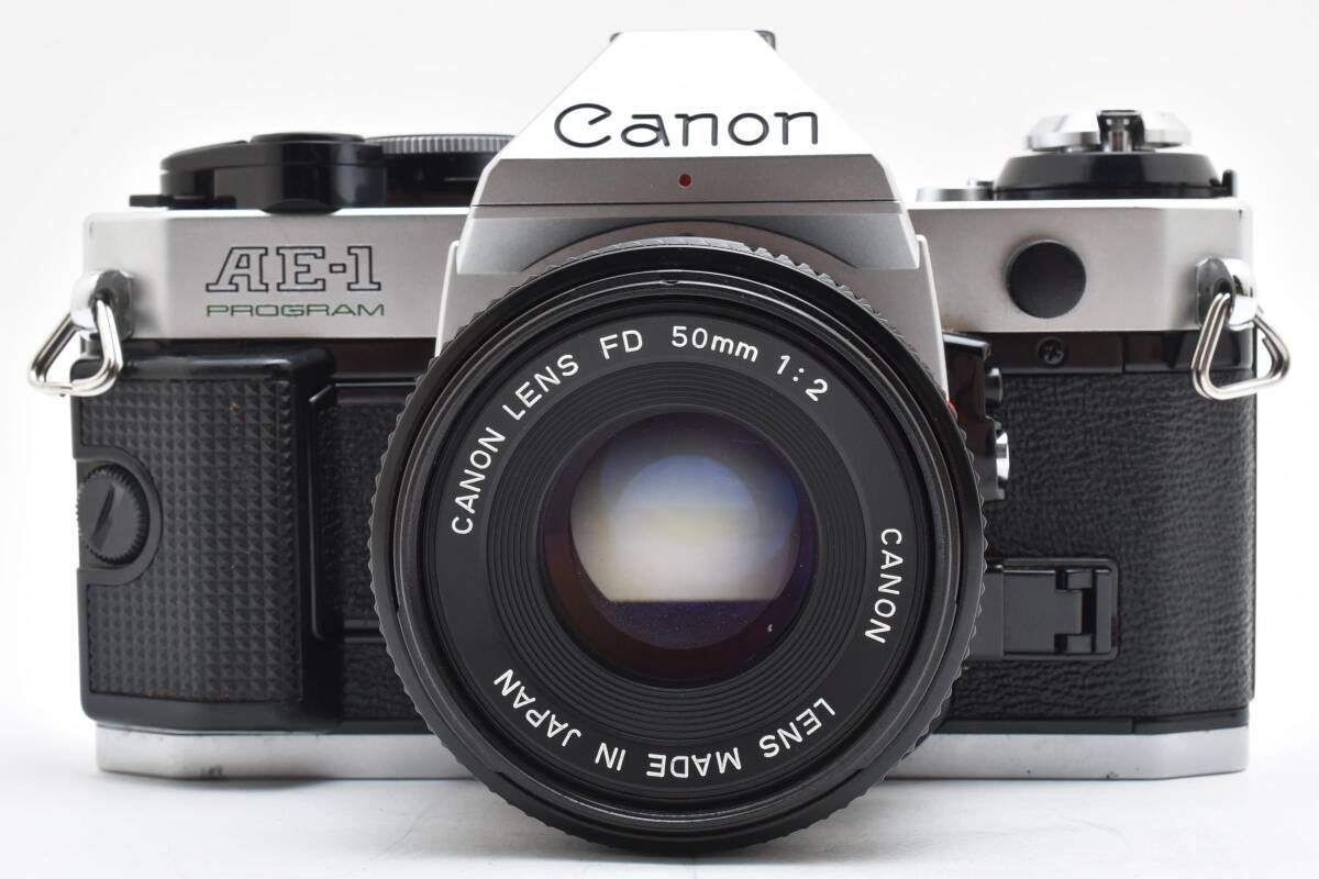 キャノン　Canon AE-1 + New FD 50mm F2 Exc+5] Canon AE-1 SLR Film Camera New FD NFD 50mm F2 LENS