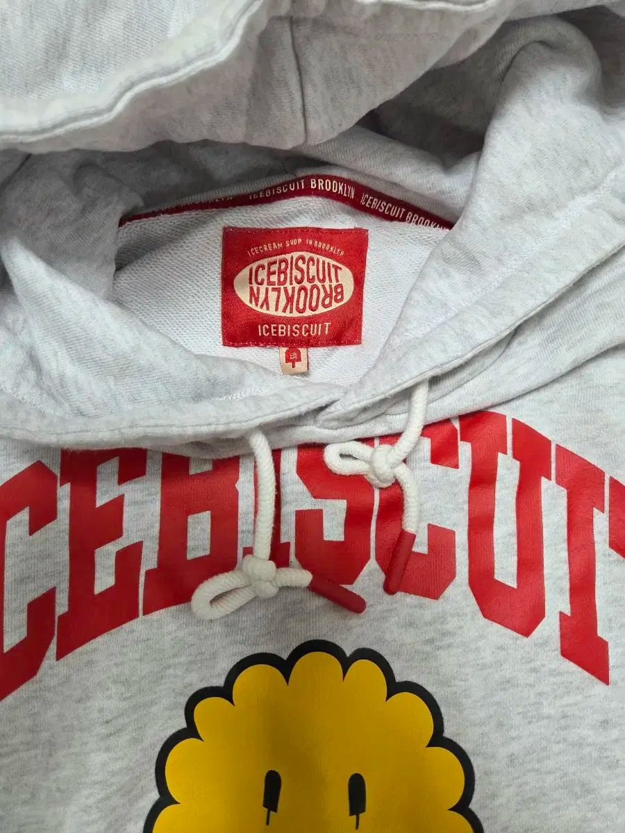 アイスビスケット スマイル フード付きTシャツ グレー