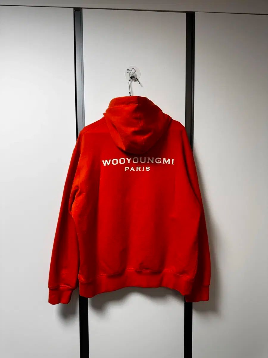 WOOYOUNGMI(ウーヨンミ) バックロゴ フード付きTシャツ オレンジ WOOYOUNGMI(ウーヨンミ) バックロゴ フード付きTシャツ オレンジ