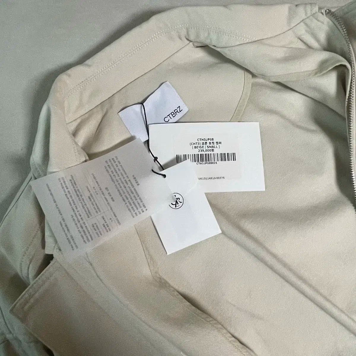 ベージュ マウンテンパーカー