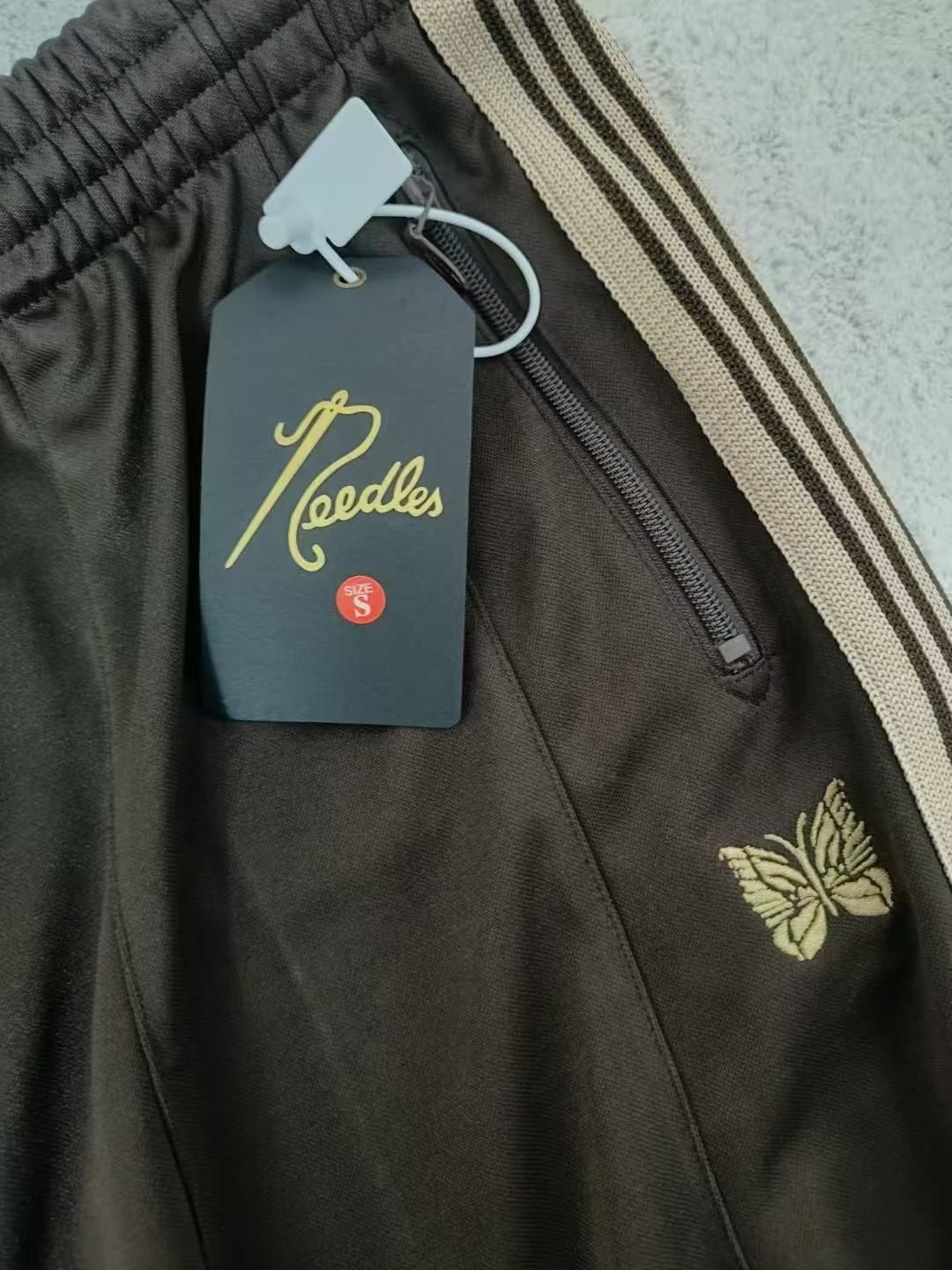 ao Needlesヒザデル 新色登場Needles ニードルス別注限定 トラック H.D. パンツ