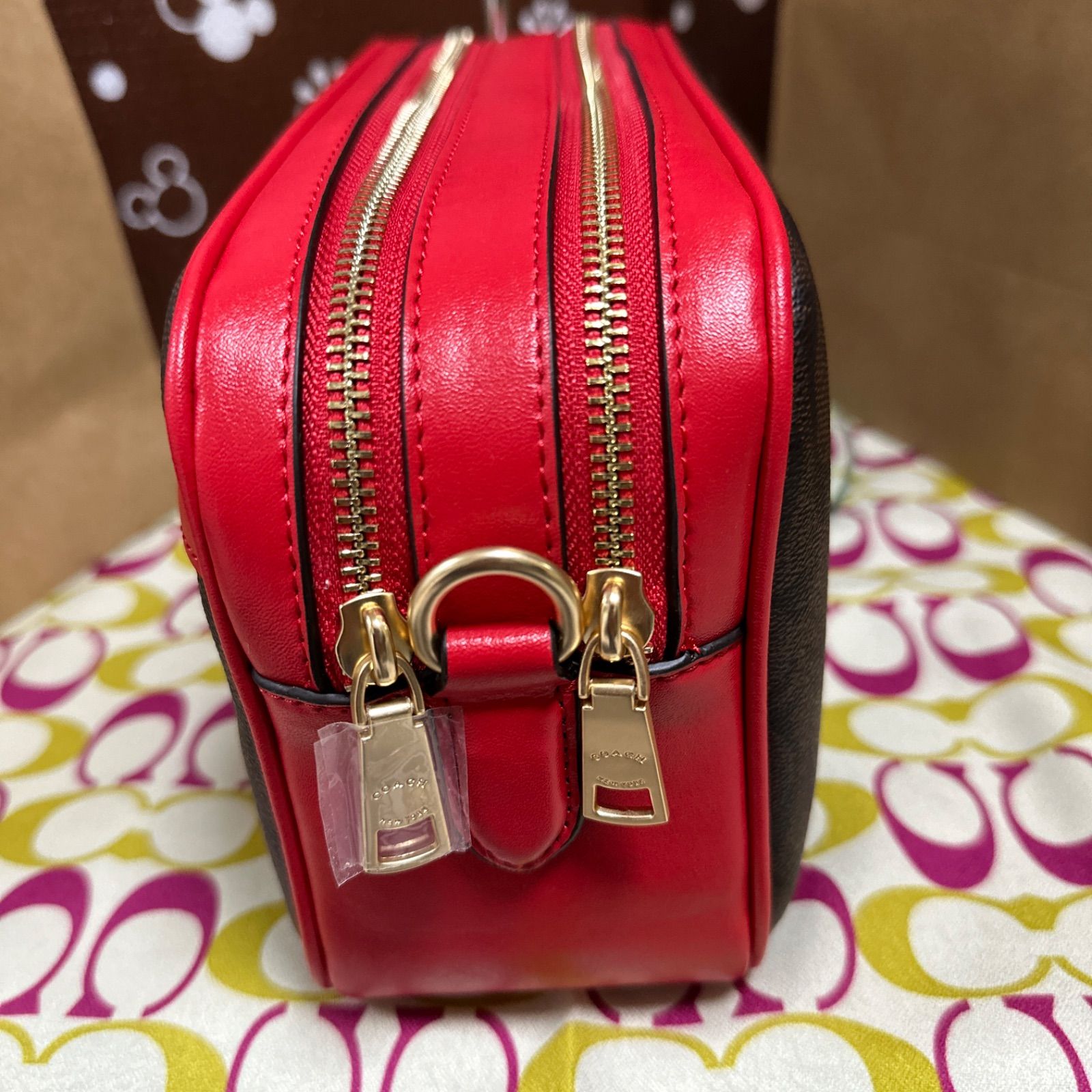 ピンクかわいい新品★COACH ショルダーバッグ PVCシグネチャー クロスボディF68168