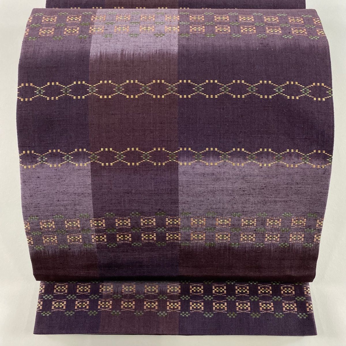 袋帯 秀品 紬地 幾何学模様 紫 全通 正絹
