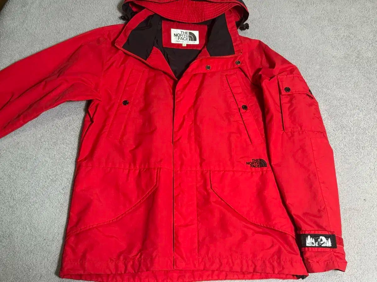 M 100 THE NORTH FACE ザノースフェイス モデル ミッドロゴ レッド マウンテン ウィンドブレーカー