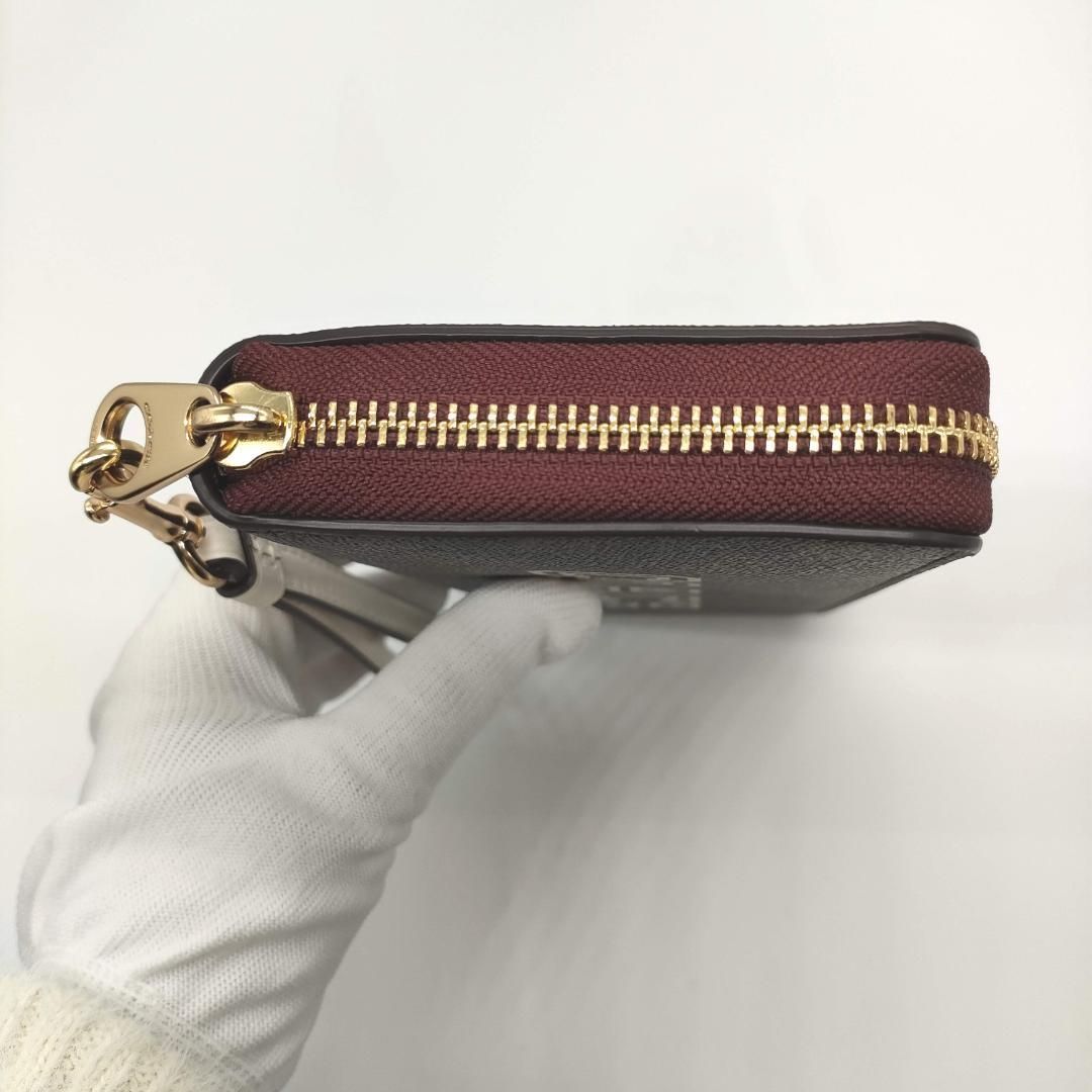 COACH] コーチ シグネチャー柄 ラウンドジップ長財布 CB856（ブラウン